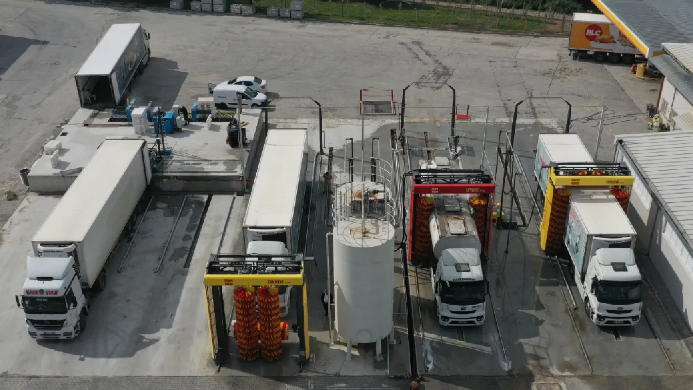 A multi-bay Europe Makine installation washing trucks and articulated trailers