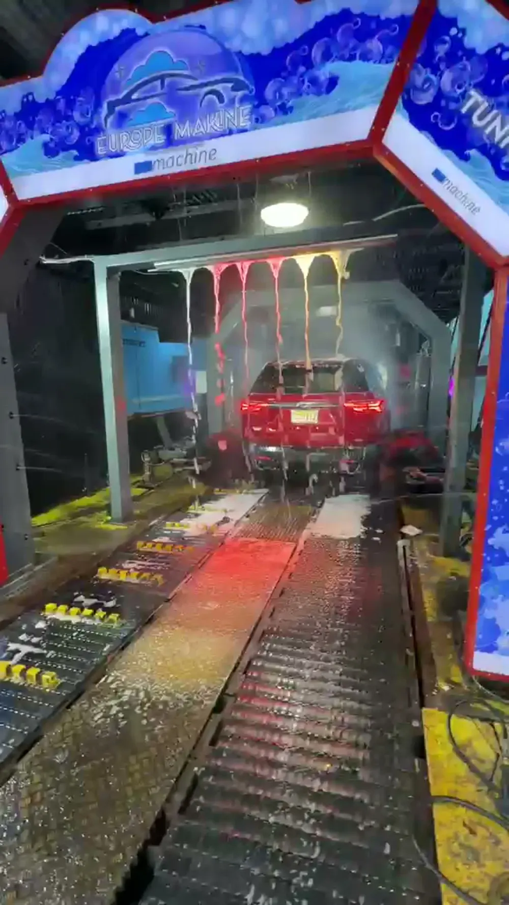 Car inside a Europe Makine branded conveyor tunnel arch in New Jersey