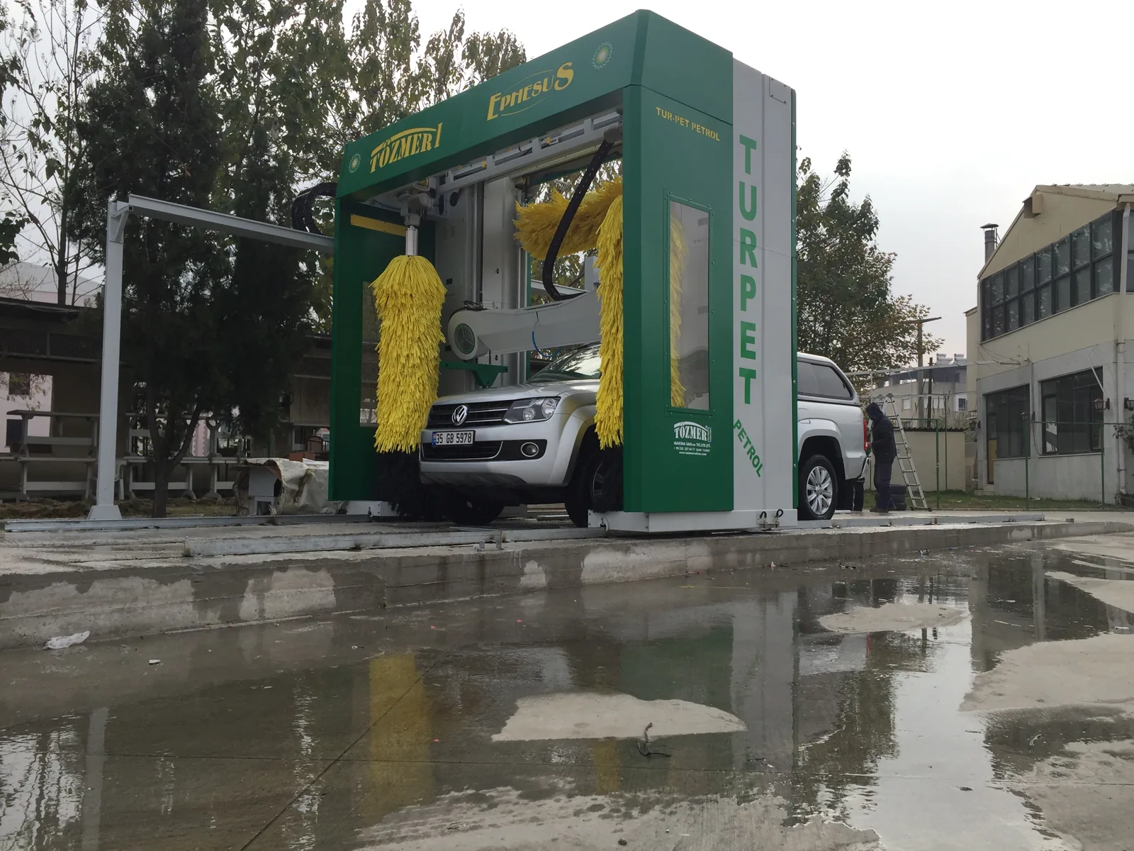 Ephesus rollover washing a pickup on a forecourt, with the EPHESUS name on the header