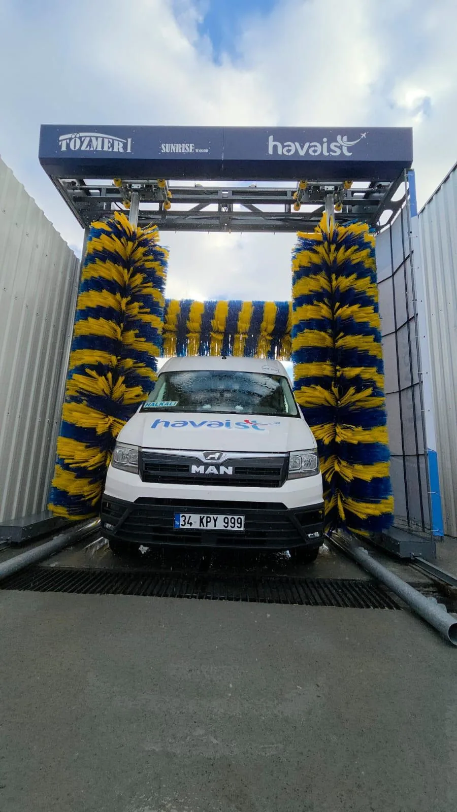 A minibus between the brushes of a SUNRISE gantry